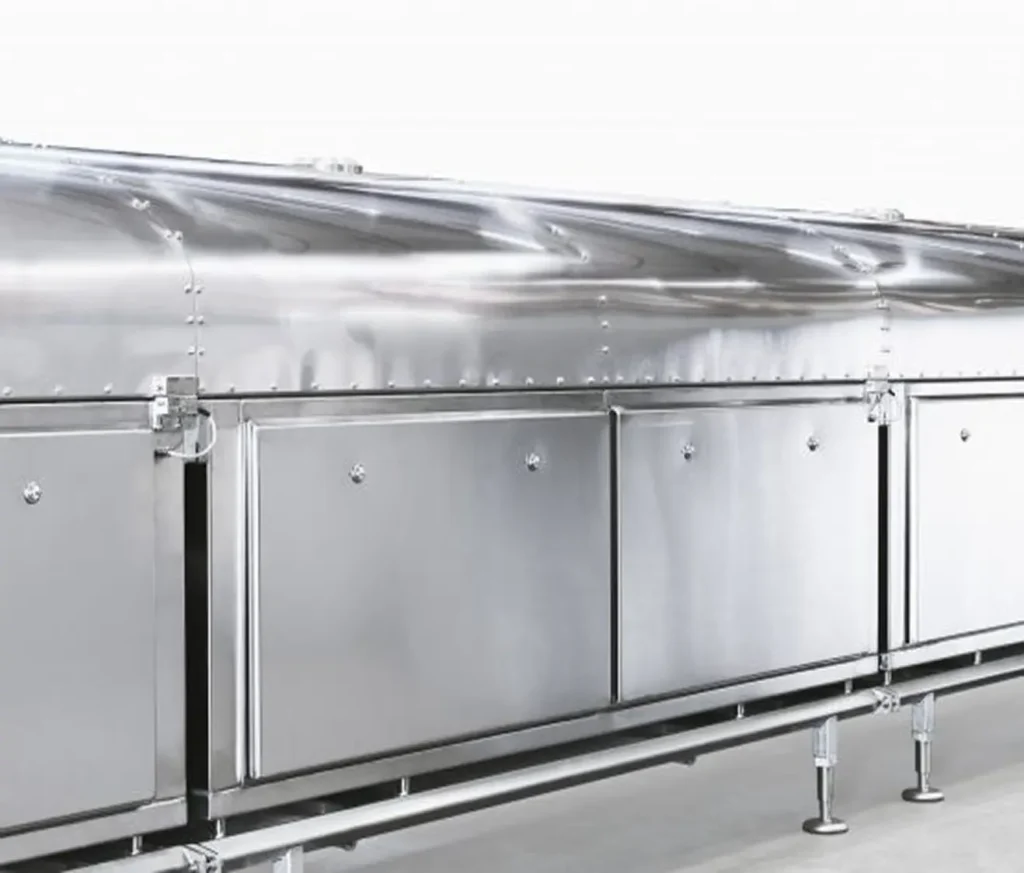 Stainless steel industrial drying tunnel with modular access panels and polished surface.